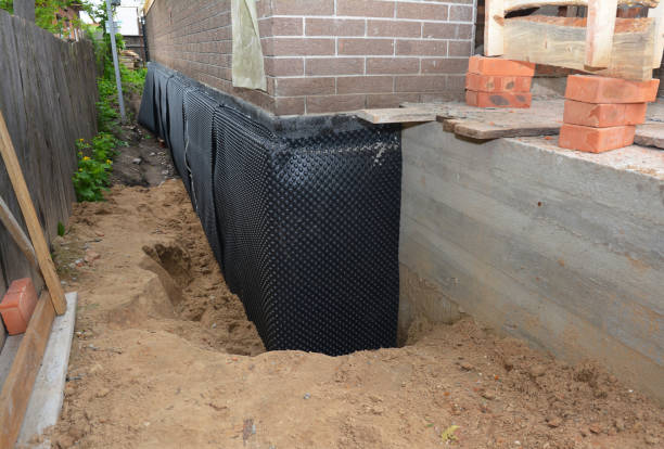 Happy homeowners after waterproofing job in Trafalgar